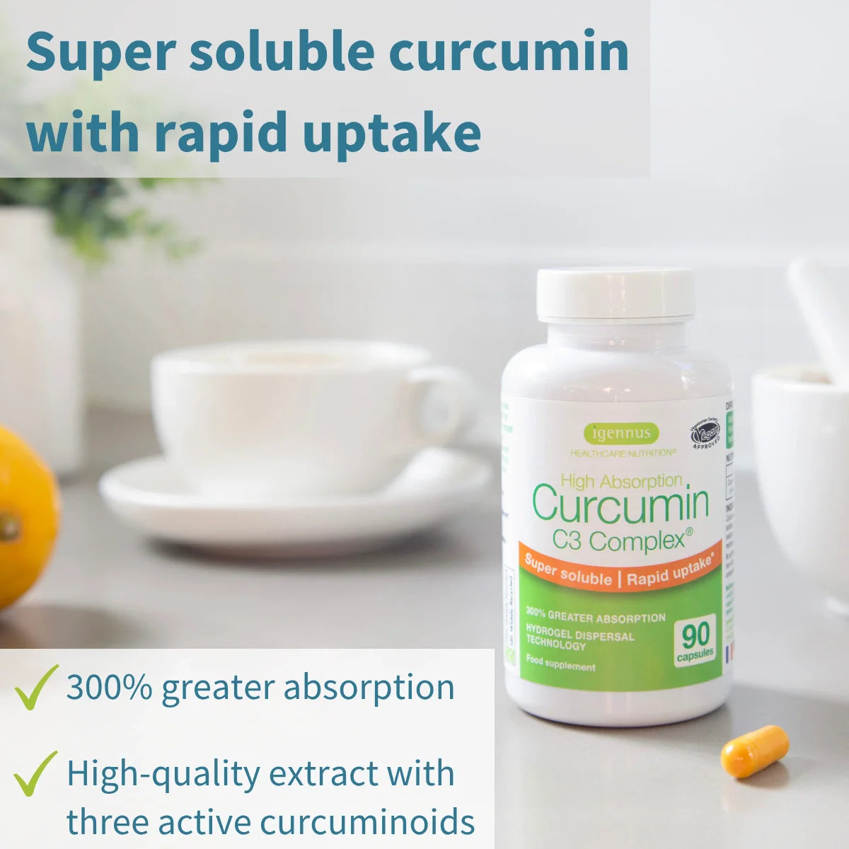 Bottle of Curcumin C3 Complex with text about super soluble curcumin and rapid uptake on a table with a cup and orange.